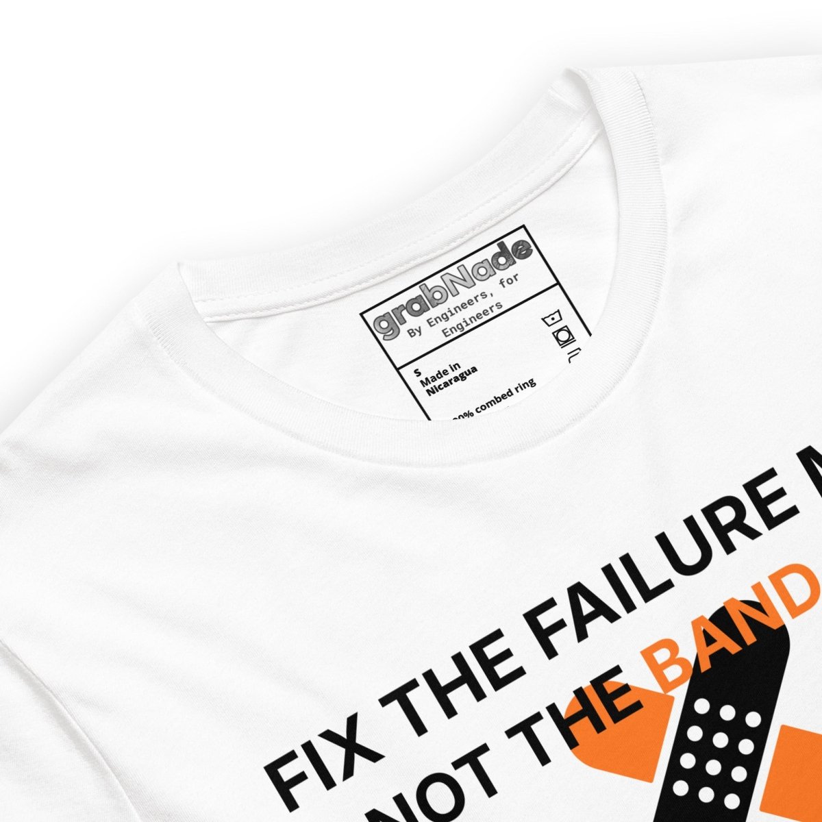 Close up of white t-shirt with "Fix the failure mode. Not the band-aids" text. For engineers & tech.