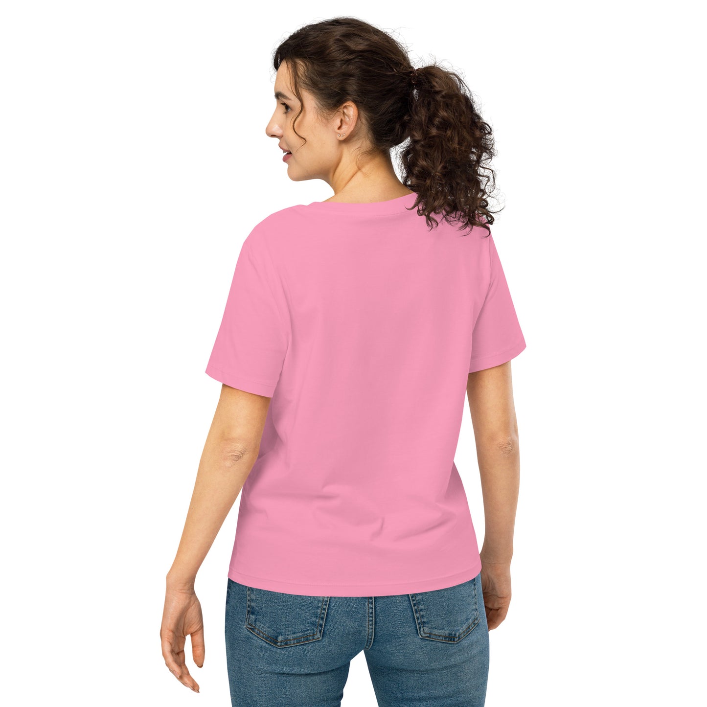 Product mockup. A woman shown from behind wearing a plain pink organic cotton t-shirt with short sleeves. The shirt has a relaxed fit, and no design or graphics appear on the back. She is also wearing blue jeans pants.