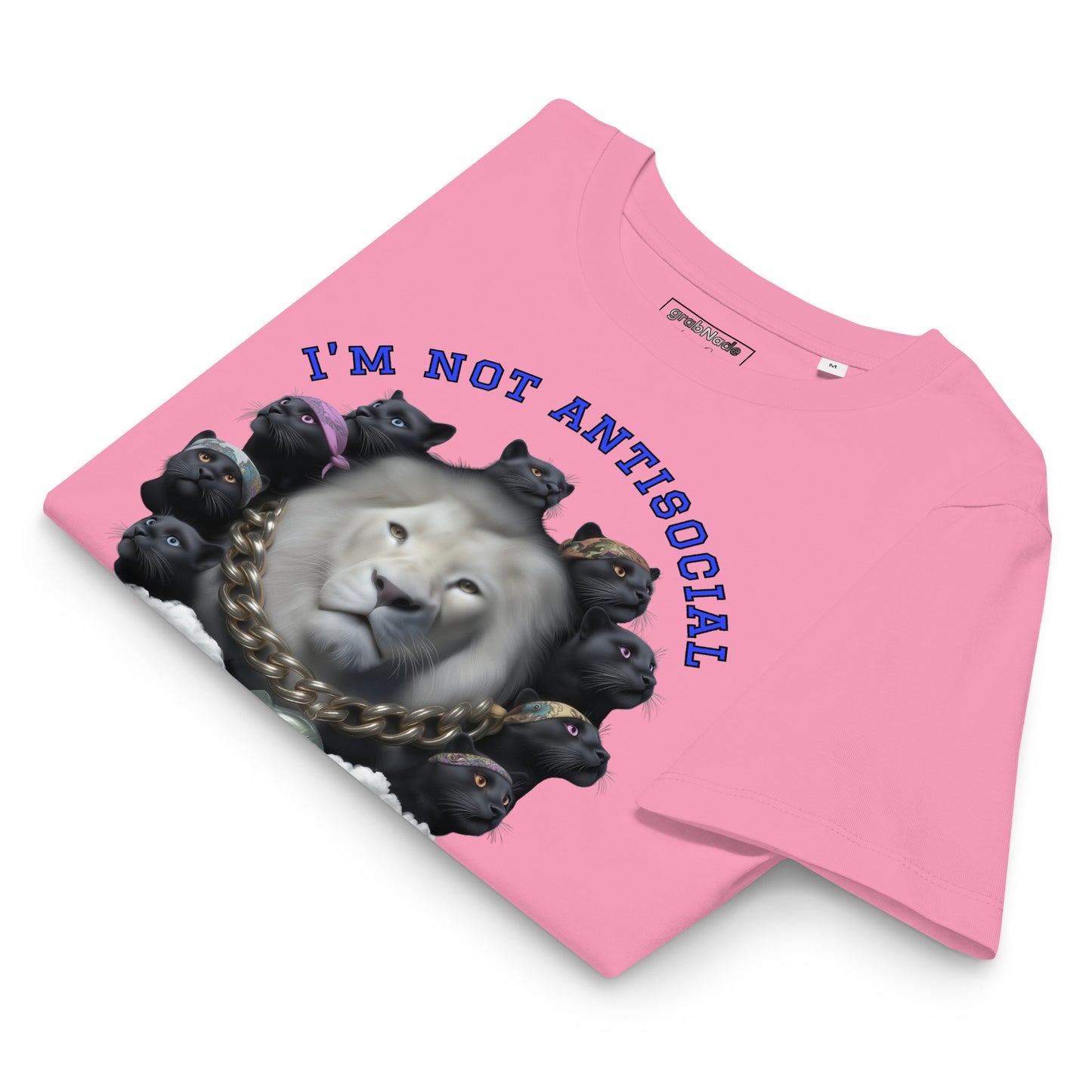 Product mockup. A folded pink organic cotton t-shirt with a bold graphic on the front showing a large white lion's head surrounded by a circle of black panthers wearing colorful bandanas. Above the image, arched blue text reads, 'I'M NOT ANTISOCIAL.