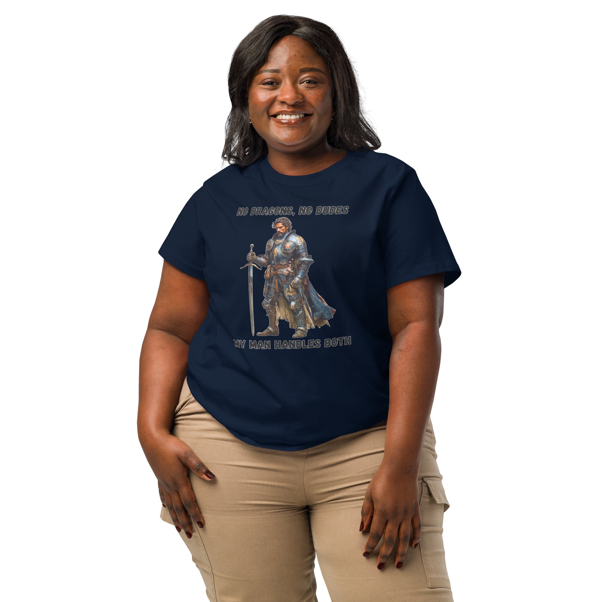 Product mockup. Organic premium navy blue t-shirt featuring warrior knight in detailed armor holding sword with bold black text above and below stating 'NO DRAGONS, NO DUDES MY MAN HANDLES BOTH,' modeled on smiling woman.