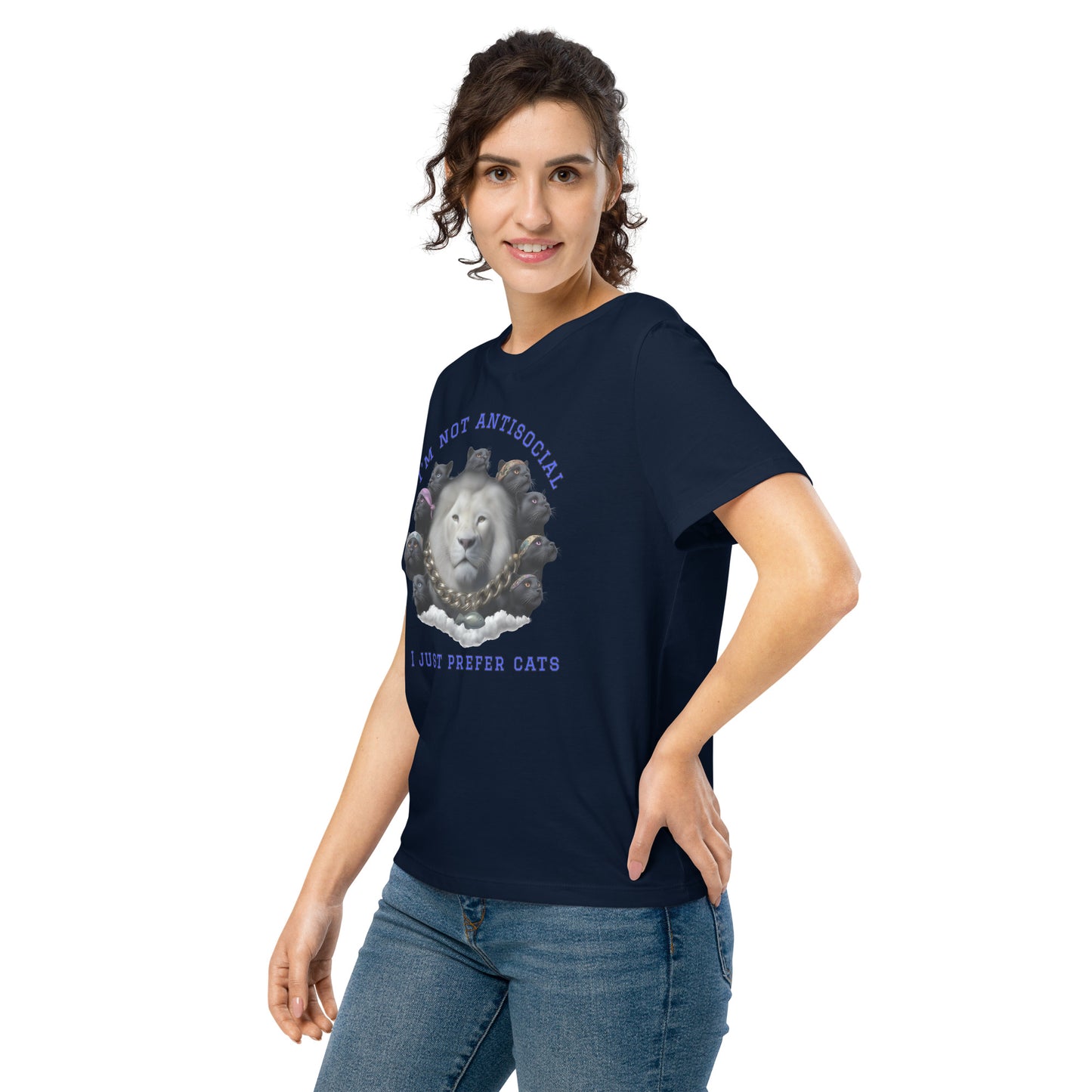 Product mockup. A woman wearing a navy blue organic cotton t-shirt featuring a bold graphic on the front: a large white lion's head surrounded by black panthers wearing colorful bandanas, arranged in a circle. Above the graphic is the phrase 'I'M NOT ANTISOCIAL' and below it reads 'I JUST PREFER CATS' in blue capital letters.