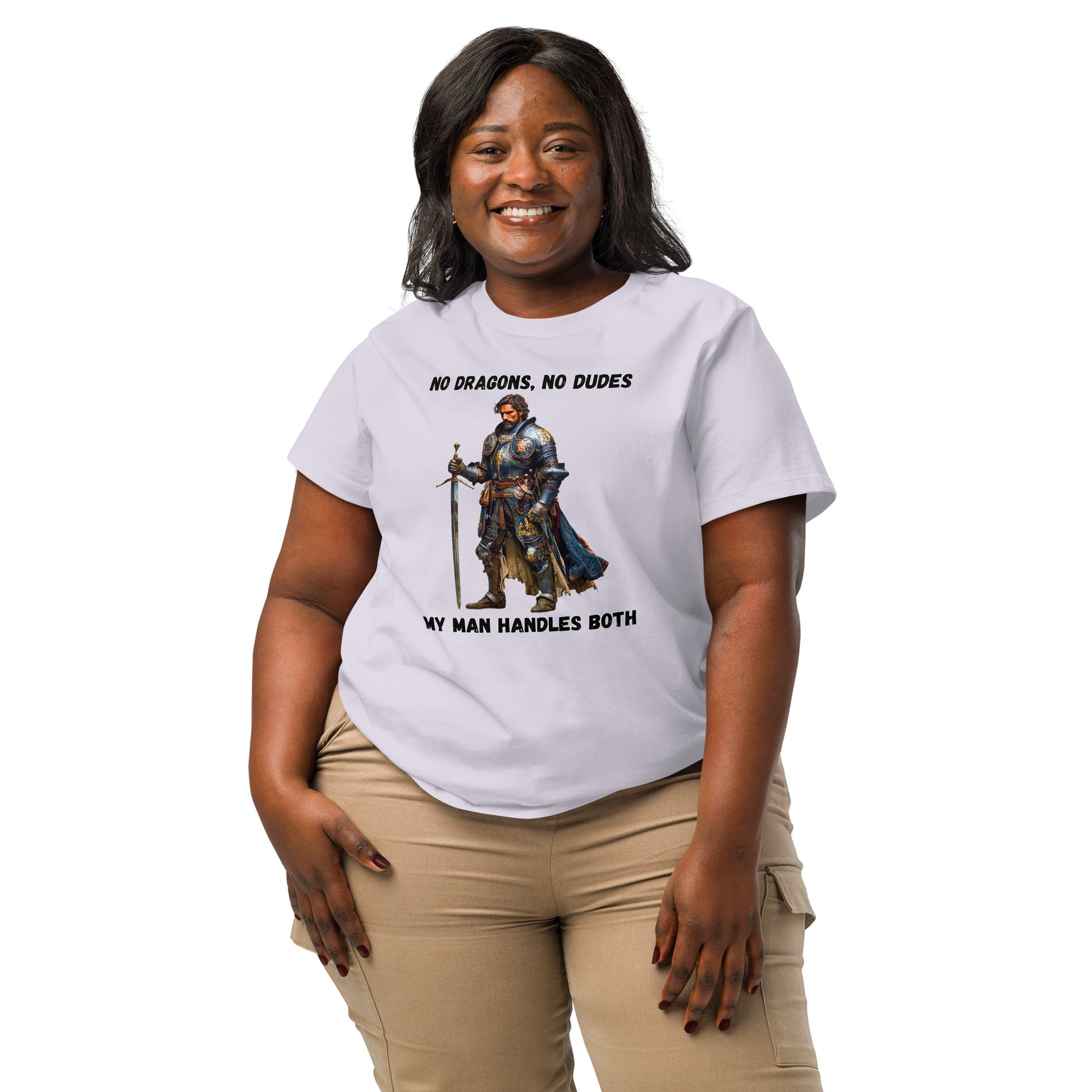 Product mockup. Organic premium lavender t-shirt featuring warrior knight in detailed armor holding sword with bold black text above and below stating 'NO DRAGONS, NO DUDES MY MAN HANDLES BOTH,' modeled on smiling woman.