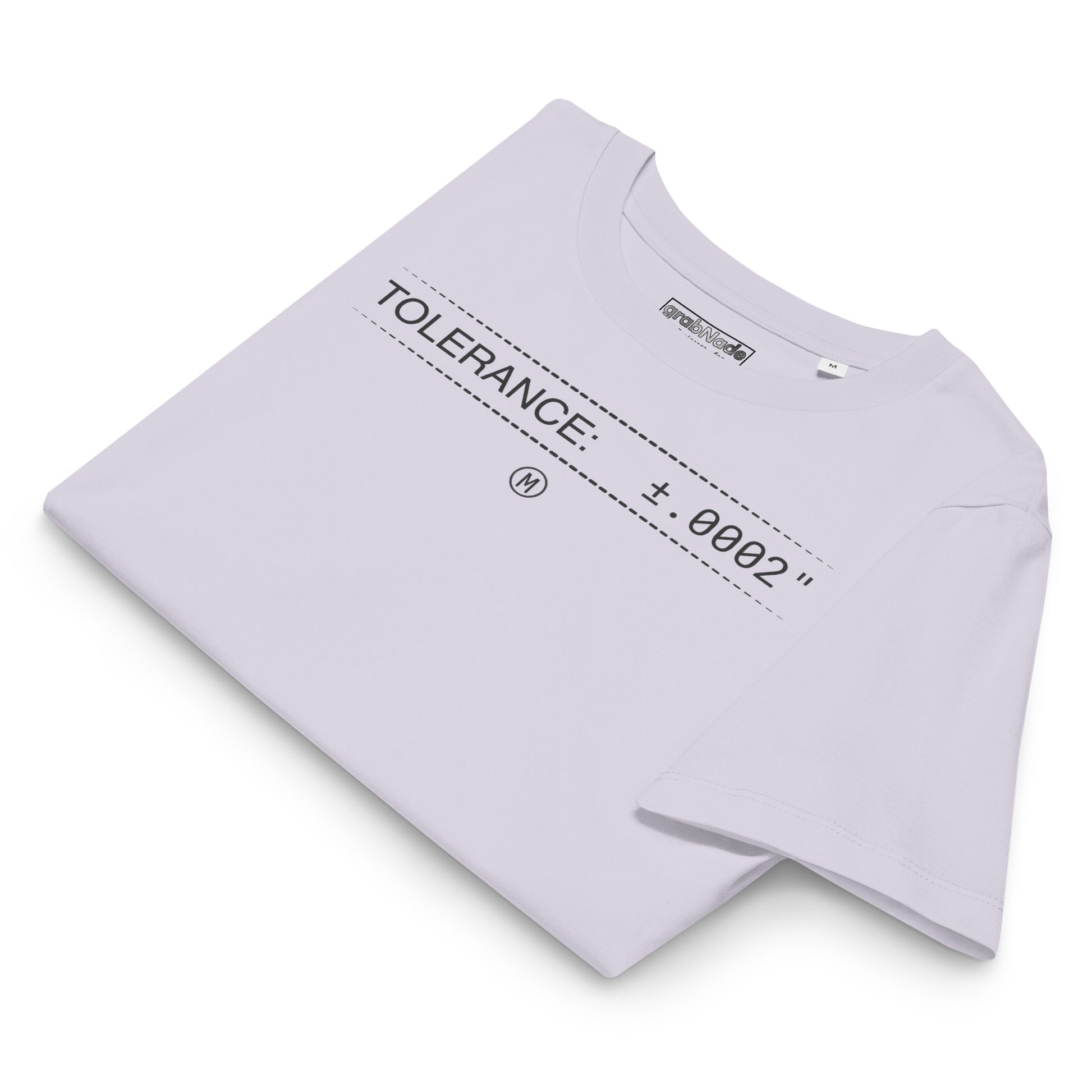 Folded organic lavender premium t-shirt with text "TOLERANCE: ±.0002" for mechanical engineers.