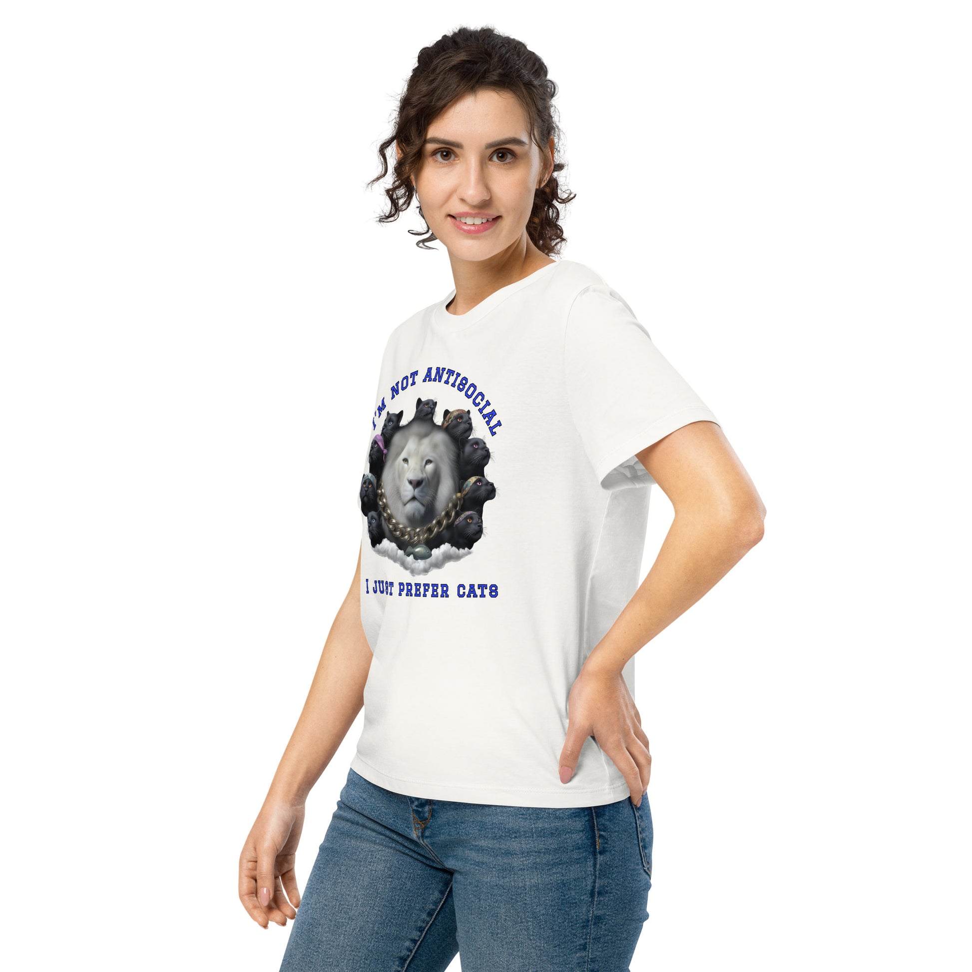 Product mockup. A woman wearing a off white organic cotton t-shirt featuring a bold graphic on the front: a large white lion's head surrounded by black panthers wearing colorful bandanas, arranged in a circle. Above the graphic is the phrase 'I'M NOT ANTISOCIAL' and below it reads 'I JUST PREFER CATS' in blue capital letters.