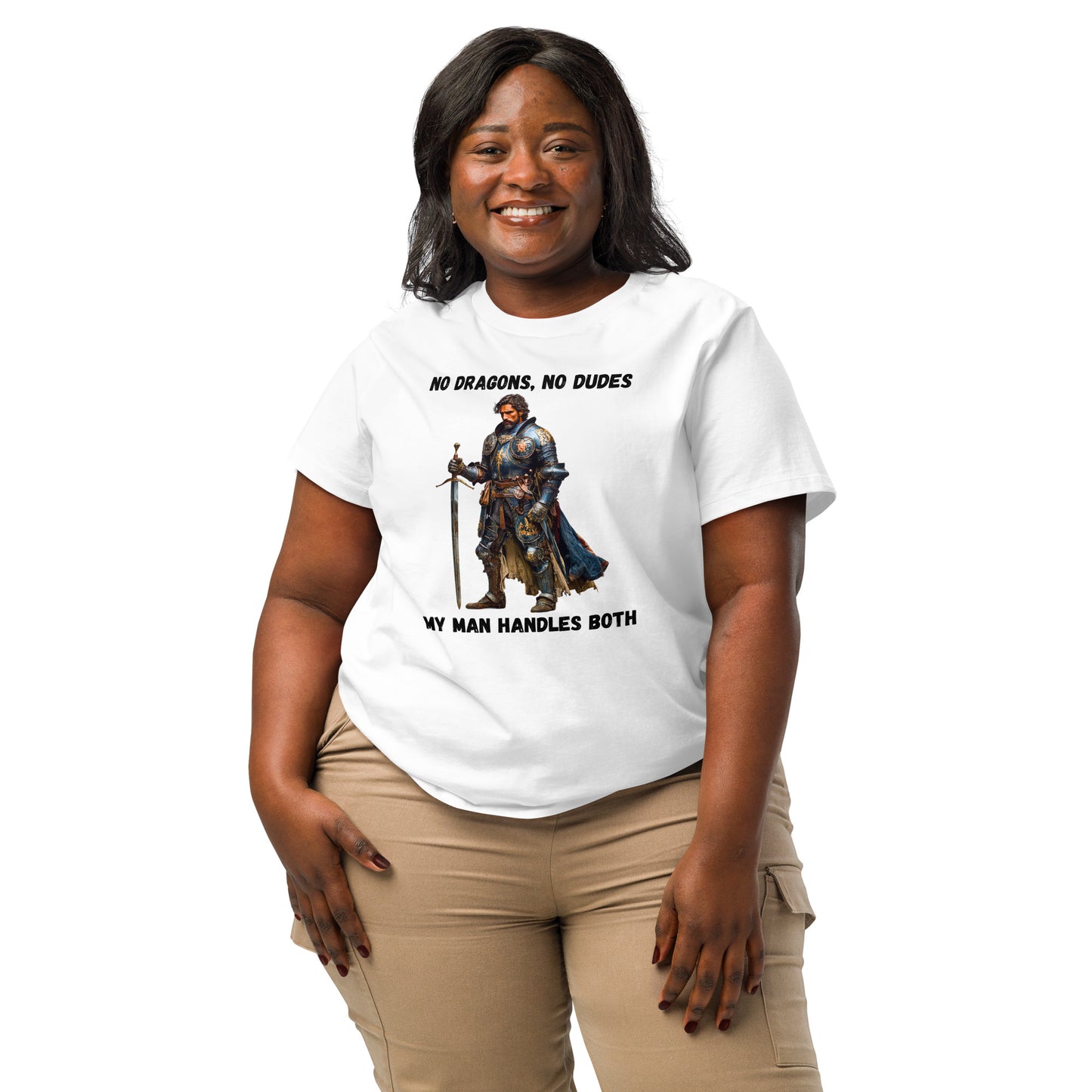 Product mockup. Organic premium white t-shirt featuring warrior knight in detailed armor holding sword with bold black text above and below stating 'NO DRAGONS, NO DUDES MY MAN HANDLES BOTH,' modeled on smiling woman.