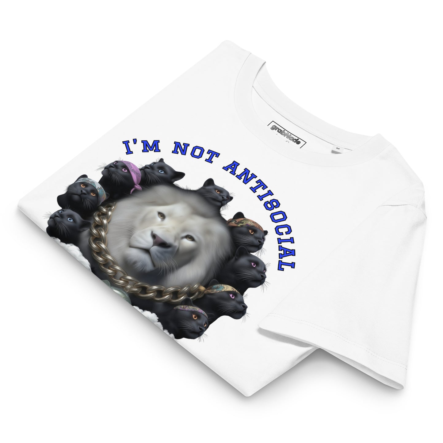 Product mockup. A folded white organic cotton t-shirt with a bold graphic on the front showing a large white lion's head surrounded by a circle of black panthers wearing colorful bandanas. Above the image, arched blue text reads, 'I'M NOT ANTISOCIAL.