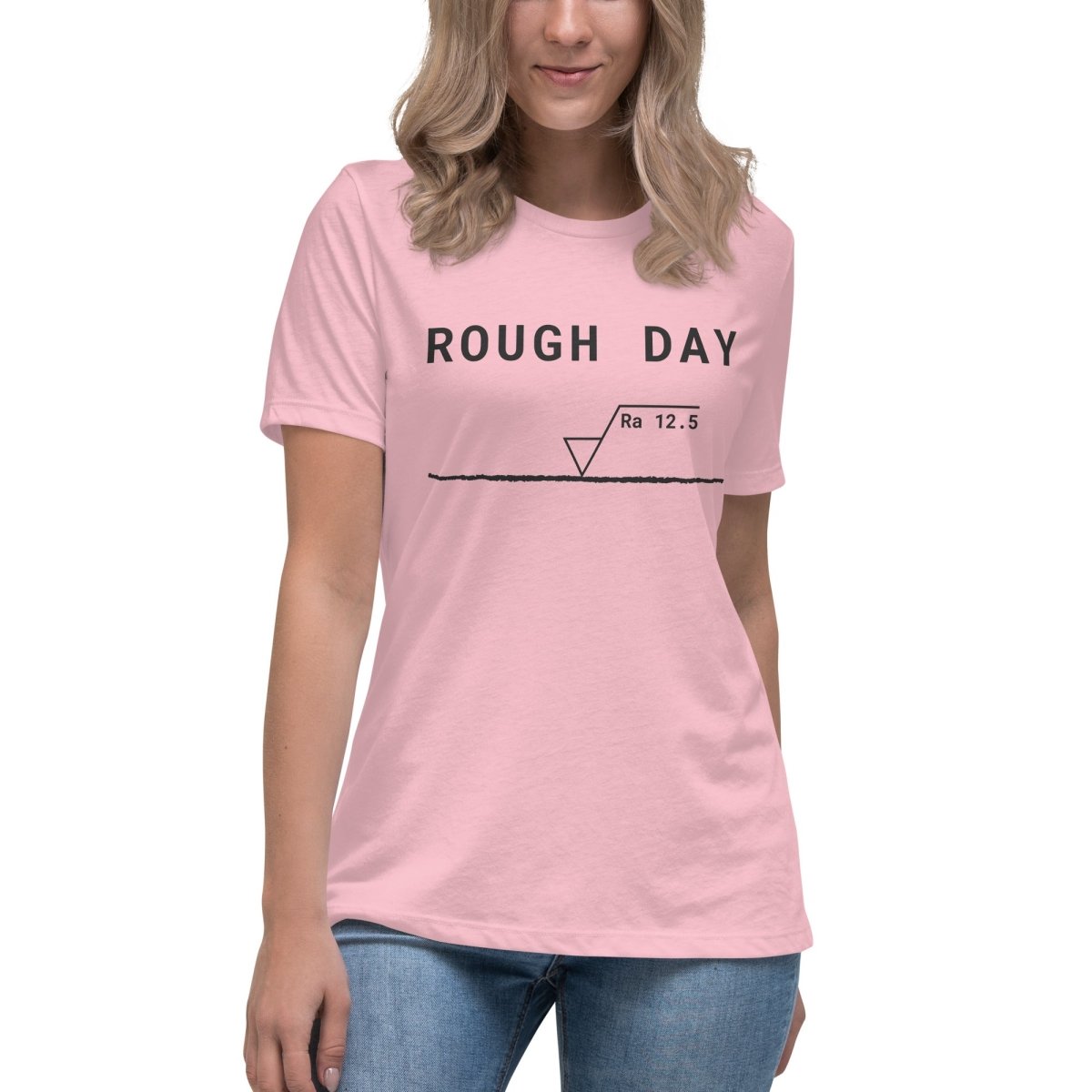 Women's cut, pink t-shirt featuring "Rough Day" text and an Ra 12.5 surface finish symbol.