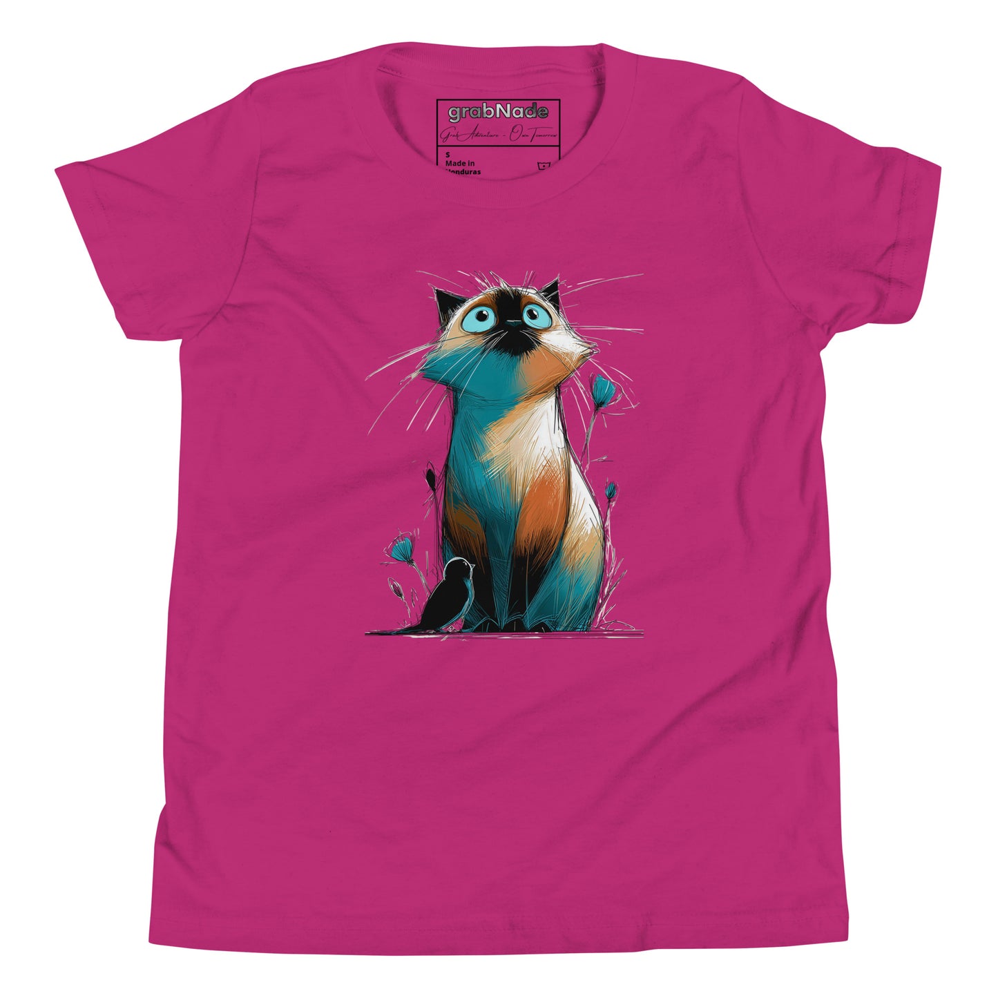 Product mockup. A pink t‑shirt featuring a whimsical, sketch-style illustration of a wide‑eyed cat with teal and orange shading sitting among delicate buds, while a small black bird rests at its feet, creating a playful yet gentle scene on a clean background.