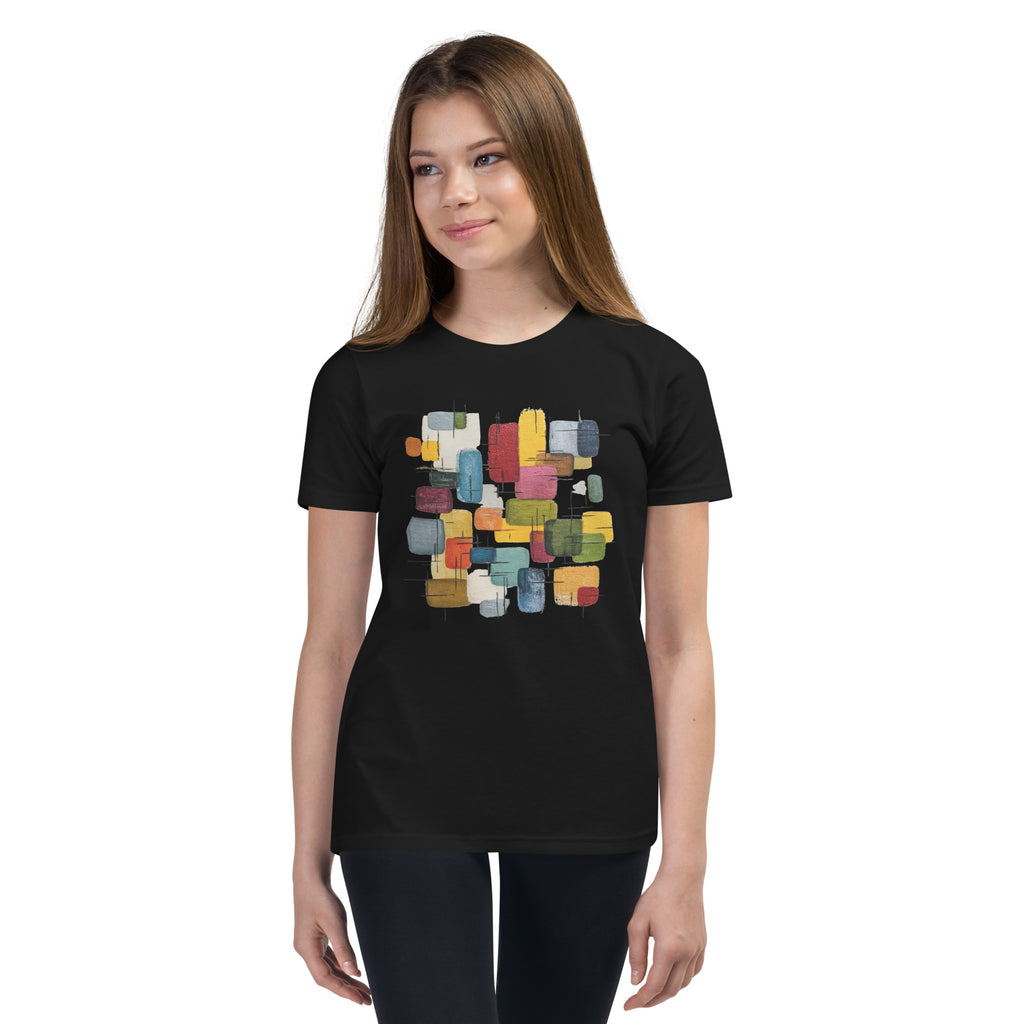 Product mockup. A young woman wearing a black, short-sleeve t-shirt with a large, colorful abstract design on the front. The design features overlapping rounded rectangles in red, yellow, teal, blue, green, and orange, with fine black sketch lines, creating a playful and modern look. She is also wearing black leggings.