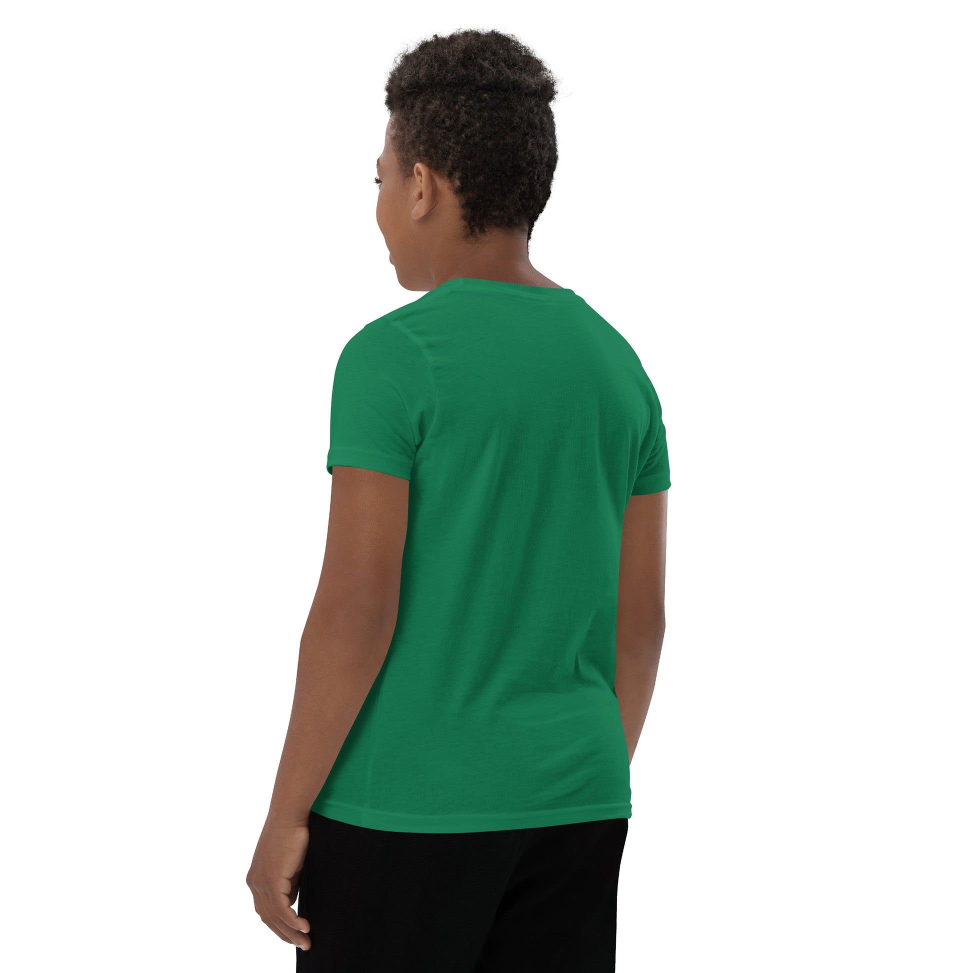 Product mockup. A boy shown from behind wearing a plain green, short-sleeve t-shirt and black pants. His curly hair is closely cropped, and the back of the shirt is blank with no visible design or graphics.