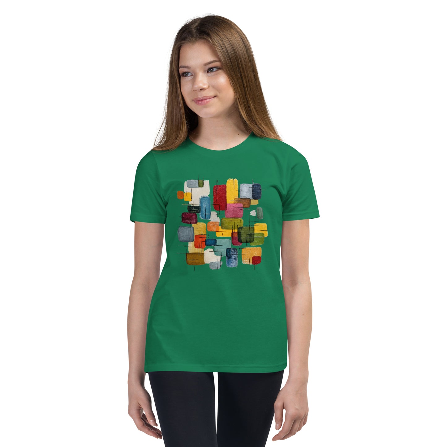 Product mockup. A young woman wearing a green, short-sleeve t-shirt with a large, colorful abstract design on the front. The design features overlapping rounded rectangles in red, yellow, teal, blue, green, and orange, with fine black sketch lines, creating a playful and modern look. She is also wearing black leggings.