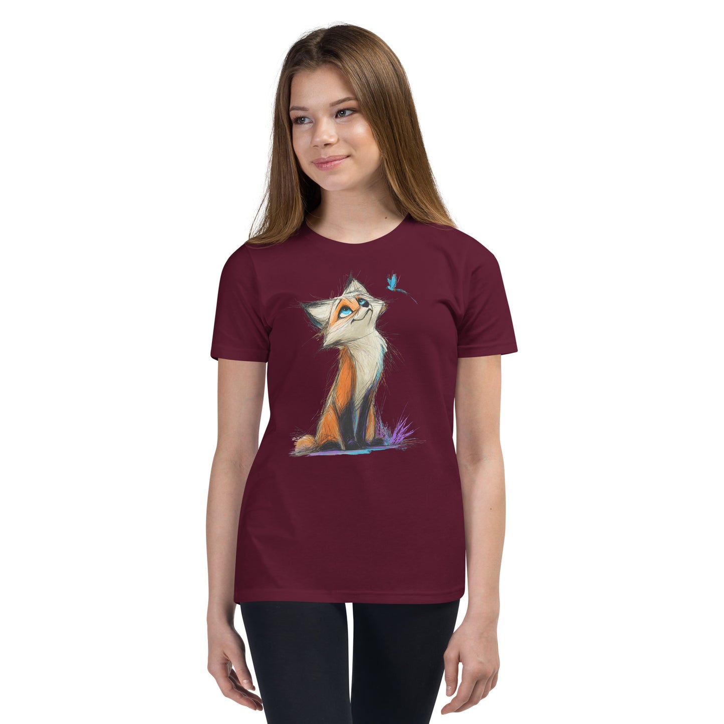 Product mockup. Ultra-soft premium youth maroon t-shirt featuring artistic colorful illustration of a curious fox looking up at a small blue butterfly, modeled on young girl.