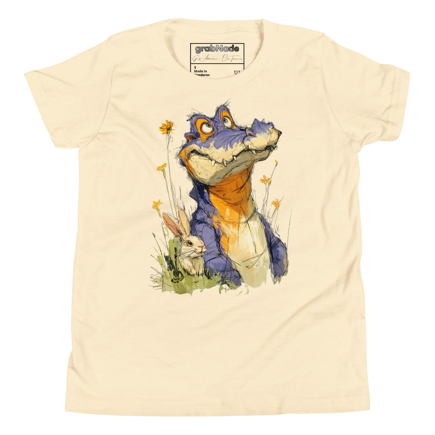 Product mockup. A playful, sketch-style illustration of a cheerful purple alligator with bright orange accents sitting in tall grass and wildflowers, accompanied by a white rabbit nestled by its side. Both characters feature expressive faces and are set against a plain beige t-shirt background, creating a whimsical and friendly scene.