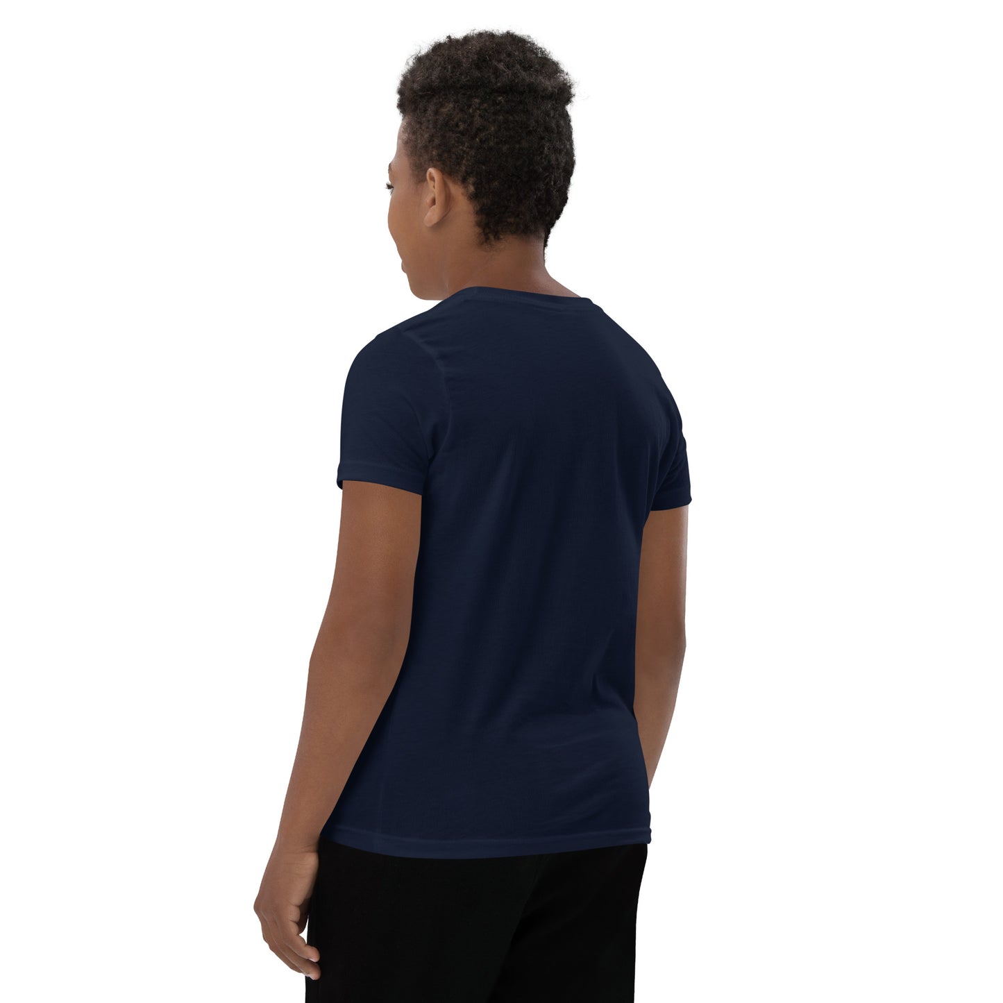 Product mockup. A boy shown from behind wearing a plain navy blue, short-sleeve t-shirt and black pants. His curly hair is closely cropped, and the back of the shirt is blank with no visible design or graphics.