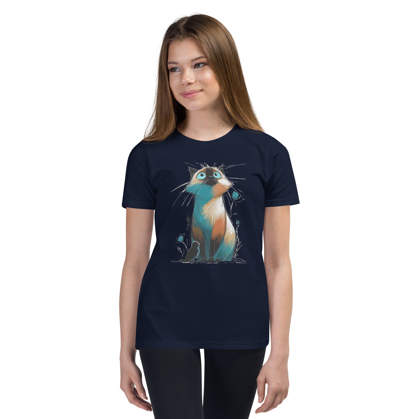 Product mockup. Ultra-soft premium youth navy blue t-shirt featuring colorful artistic drawing of a wide-eyed cat sitting beside flowers and a black bird, modeled on young girl.