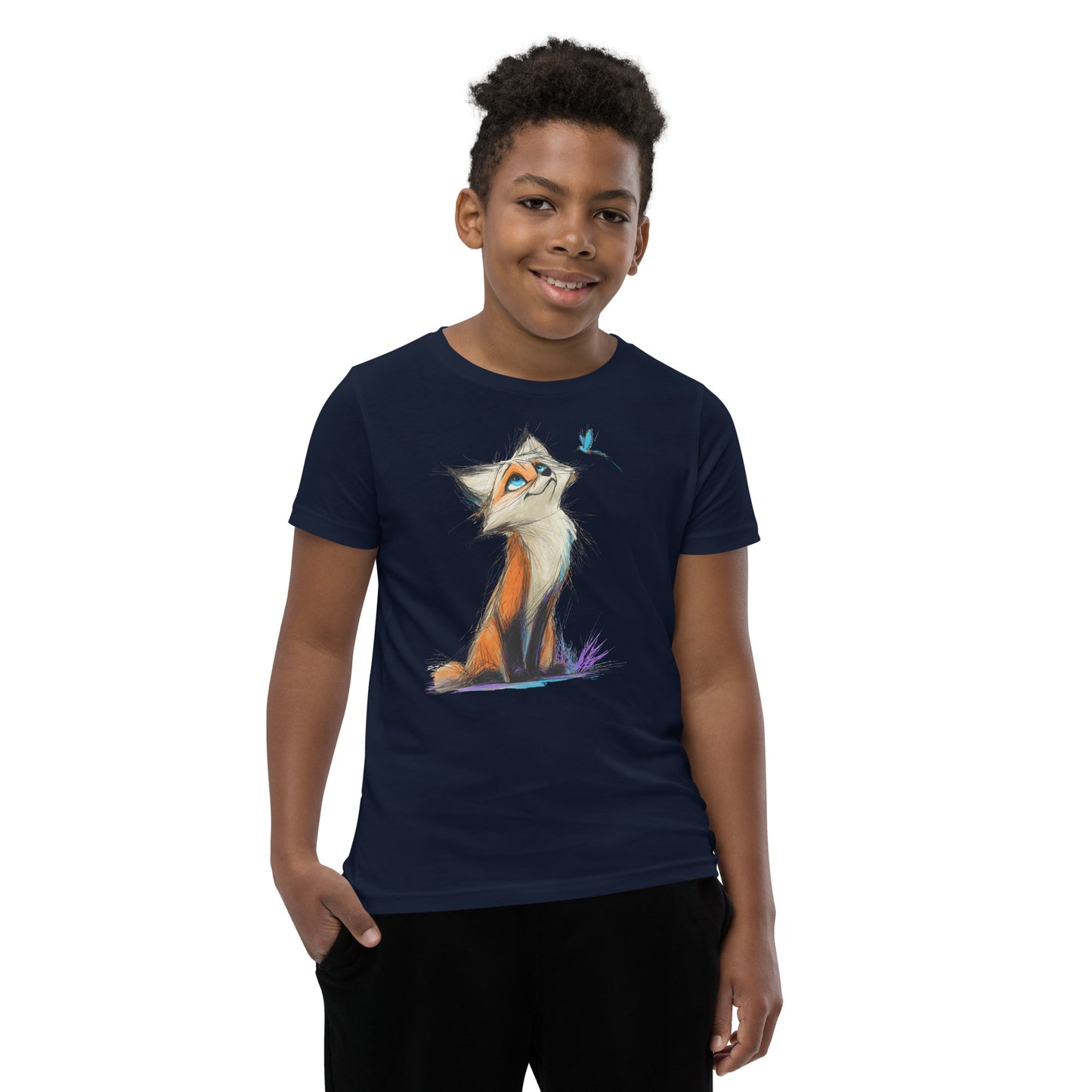 Product mockup. A smiling young boy wearing a navy blue t-shirt adorned with a playful, sketch-style illustration of a bright orange and white fox sitting on the ground, gazing up curiously at a small blue butterfly fluttering near its face. The background is clean and studio-lit, emphasizing the colorful and whimsical design of the shirt.