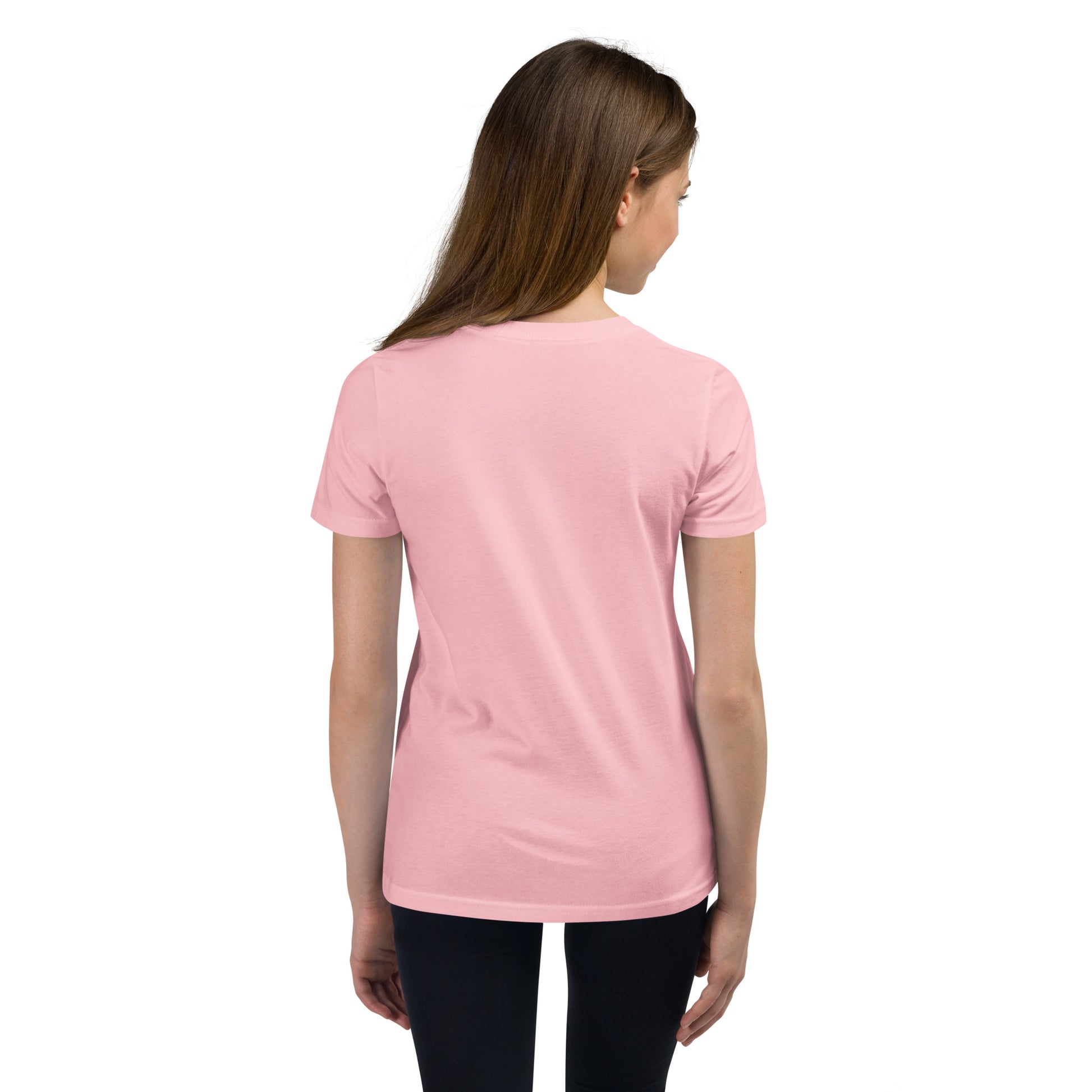 Product mockup. A girl shown from behind wearing a plain light pink, short-sleeve, fitted t-shirt and black leggings. Her straight brown hair falls over her shoulders, and the back of the shirt has no visible design or graphics.