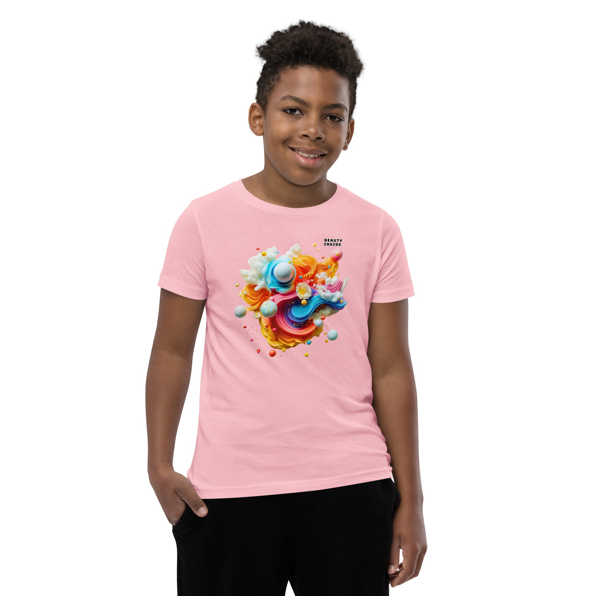 Product mockup. A young boy in a vibrant pink t-shirt featuring a dynamic abstract design at the chest with swirling strokes of yellow, orange, pink, and blue, accented by playful 3D spheres, clouds, and flowers. Near the upper right area of the design, small white block text reads, 'BEAUTY INSIDE