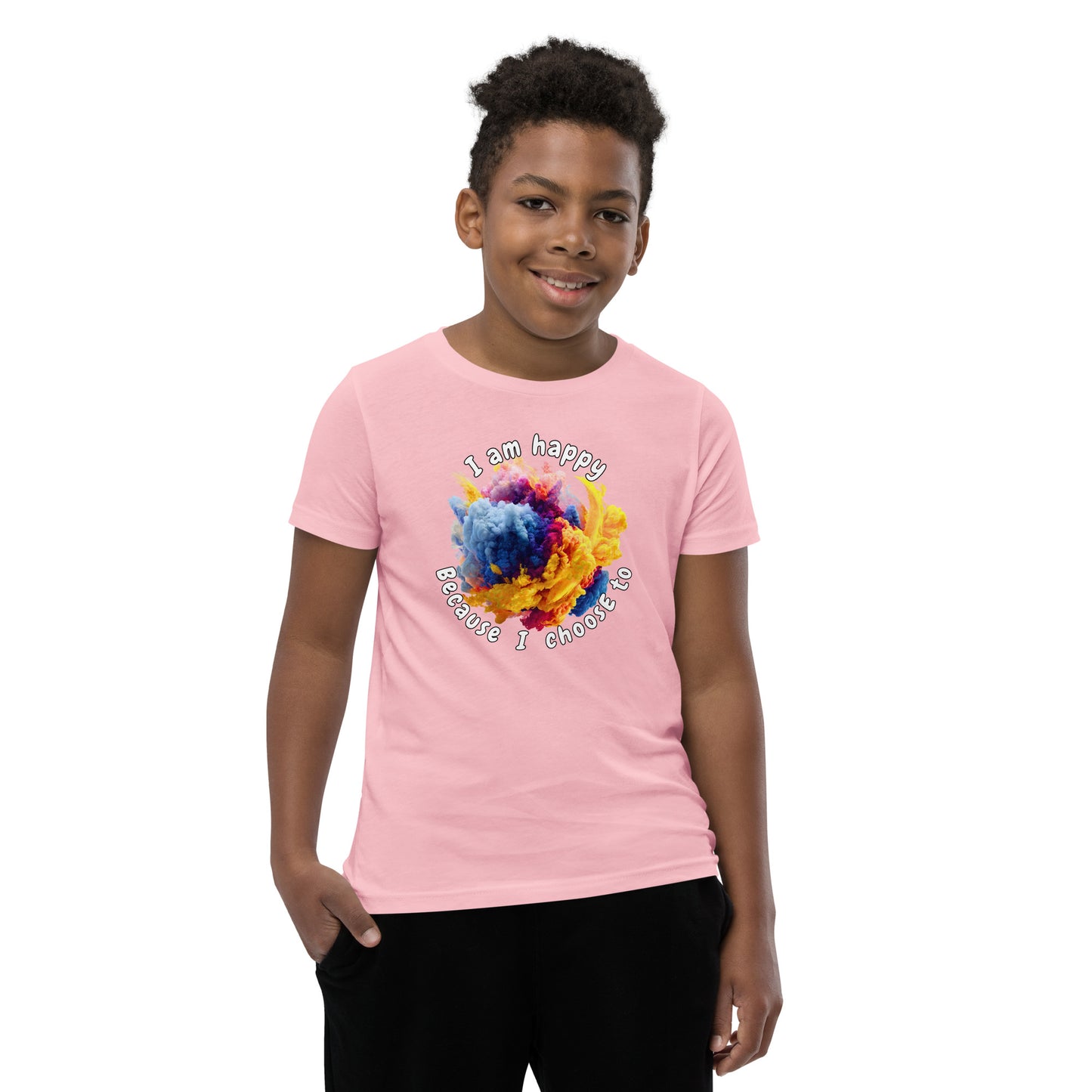 Product mockup. A smiling young boy wearing a light blue t-shirt with a colorful, cloud-like burst of blue, pink, purple, and yellow at the chest. Above and below the design, curved white text reads, 'I am happy Because I choose to,' in a playful, rounded font.