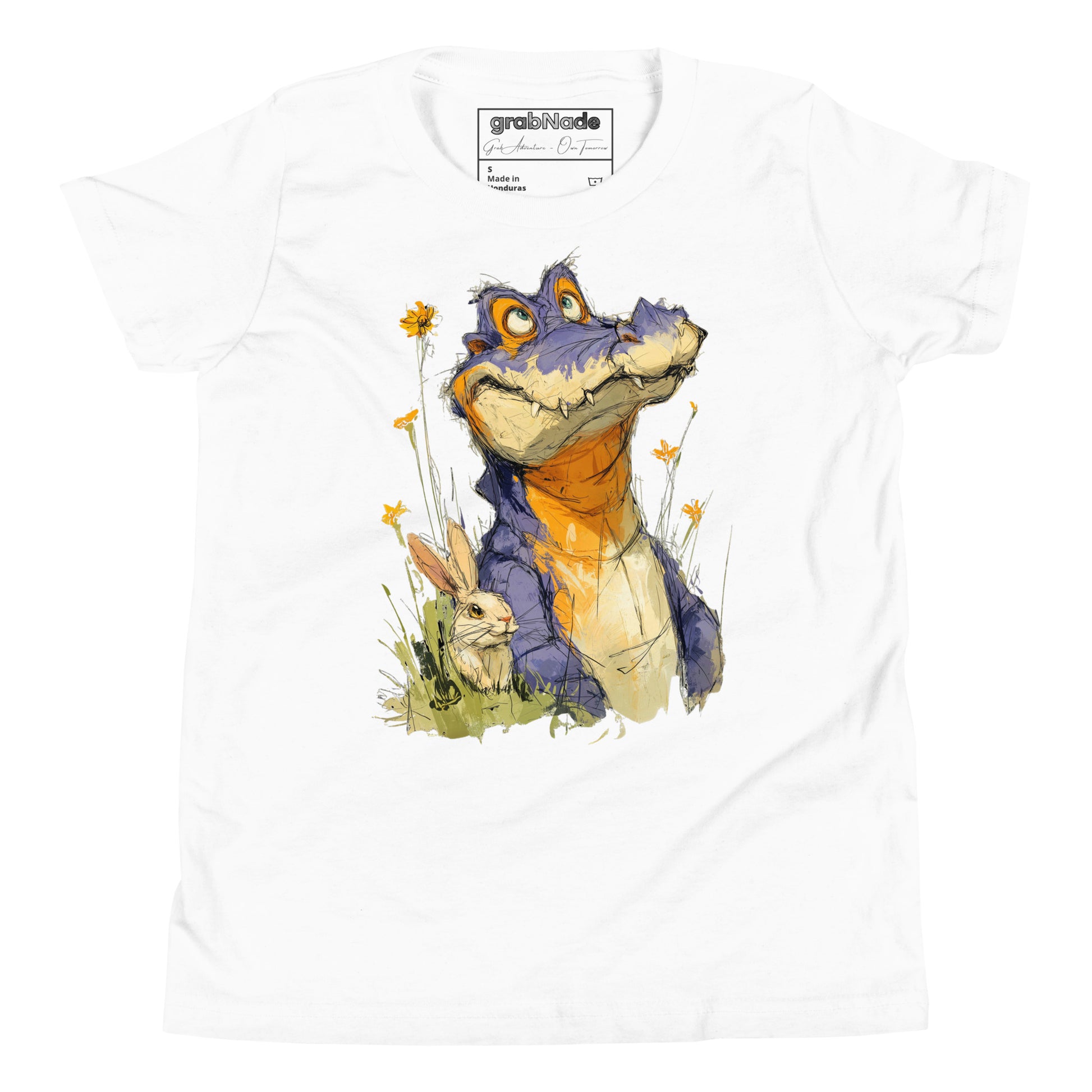 Product mockup. Ultra-soft premium youth white t-shirt featuring whimsical colorful illustration of a playful purple and orange alligator sitting in grass next to a small rabbit and yellow wildflowers.