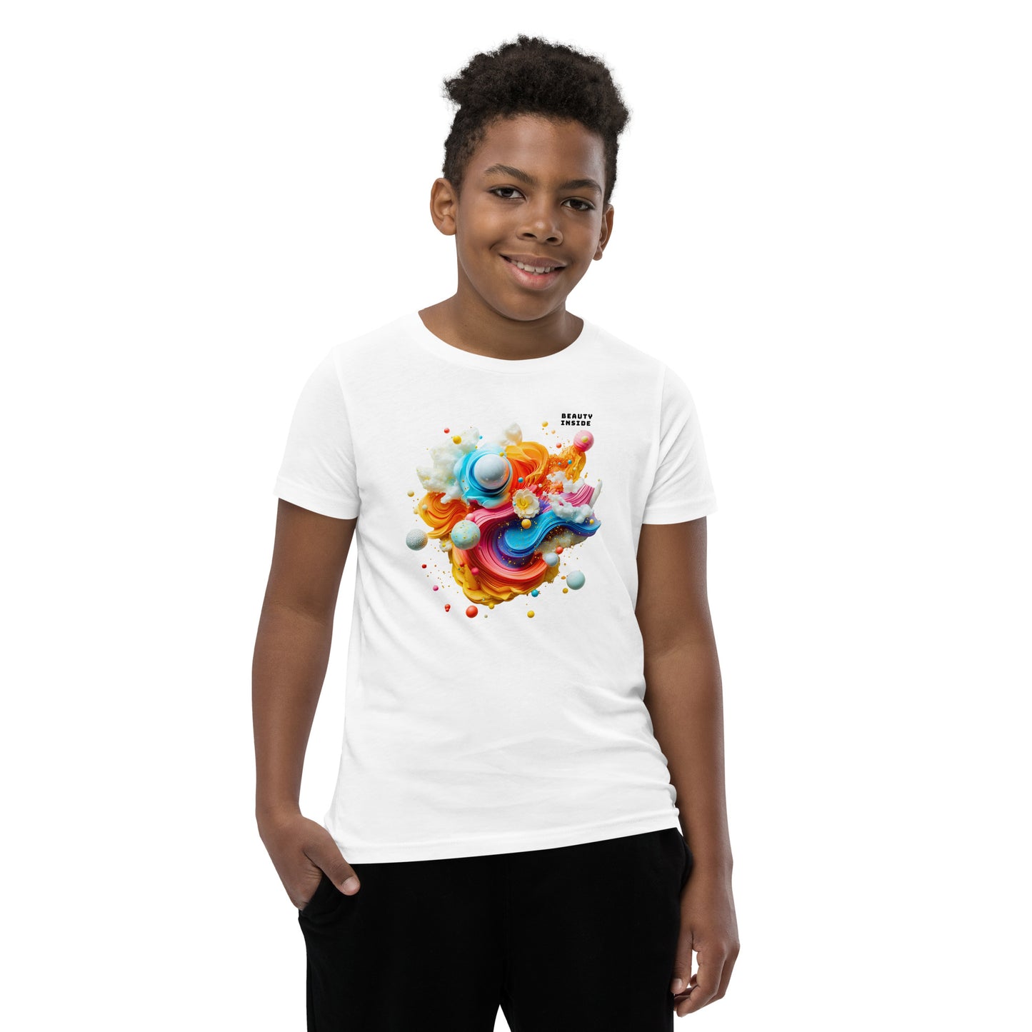 Product mockup. A young boy in a vibrant white t-shirt featuring a dynamic abstract design at the chest with swirling strokes of yellow, orange, pink, and blue, accented by playful 3D spheres, clouds, and flowers. Near the upper right area of the design, small white block text reads, 'BEAUTY INSIDE