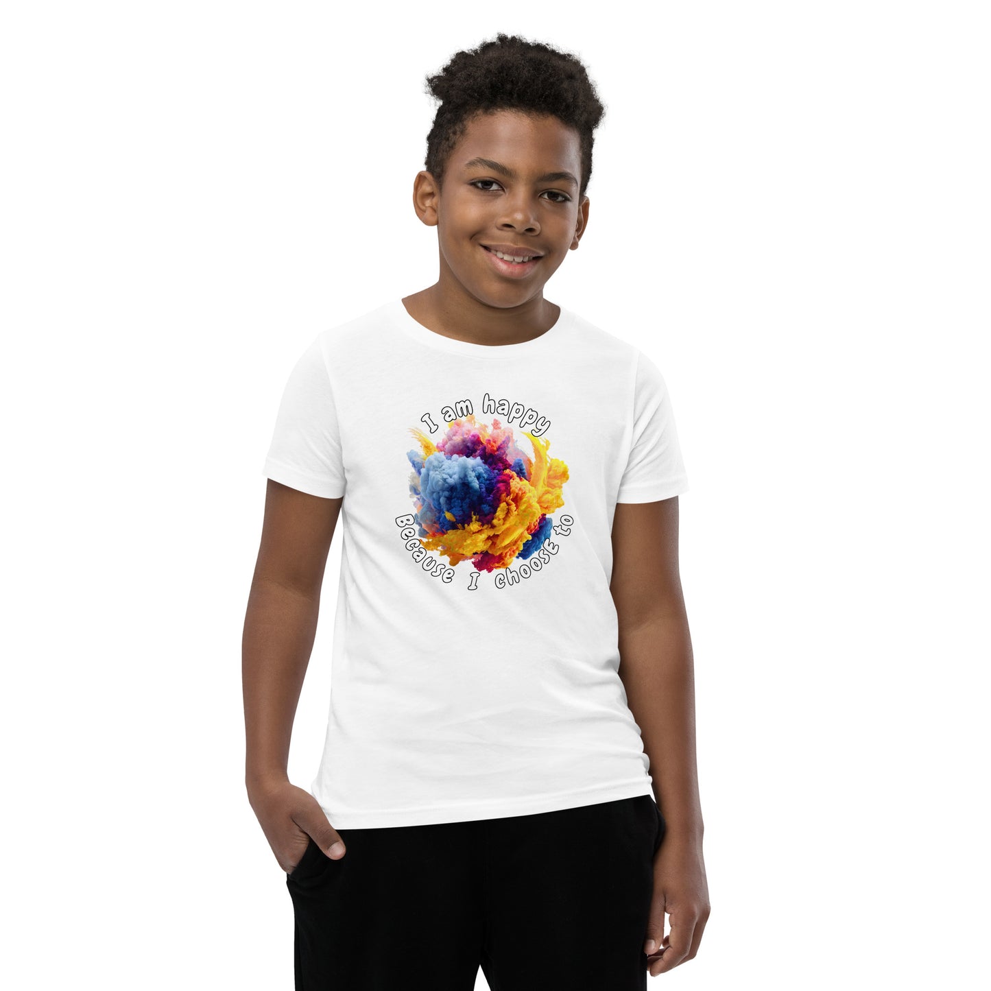 Product mockup. A smiling young boy wearing a white t-shirt with a colorful, cloud-like burst of blue, pink, purple, and yellow at the chest. Above and below the design, curved white text reads, 'I am happy Because I choose to,' in a playful, rounded font.